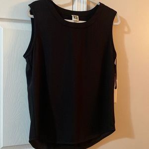 Ann Klein medium top. Too large for my wife. Great condition